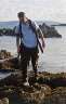 Me clambering over rocks on the beach. 