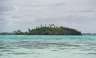 Possibly an island, possibly just an outcropping on the other side of the lagoon. 