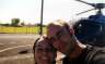 Us in front of the helicopter, back on the ground at last.